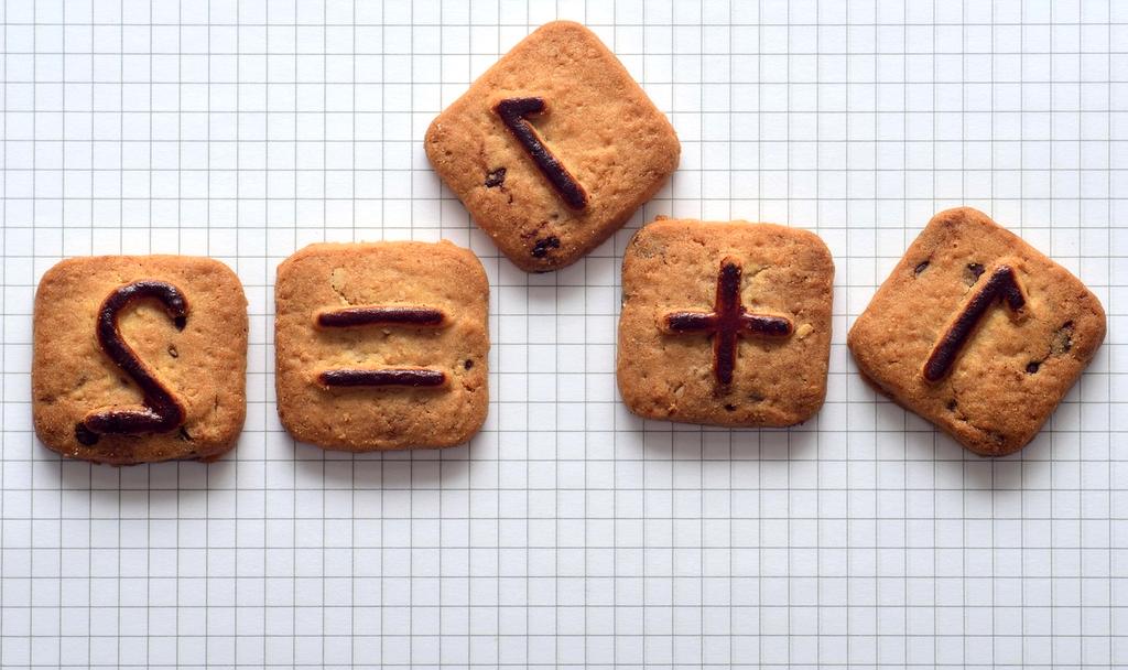 Close-up of cookie jar with assorted cookies on wooden table
